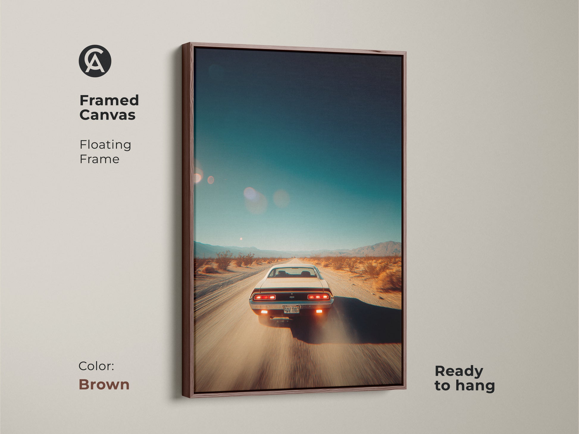 Brown framed canvas artwork featuring a classic car driving on a desert road. The floating frame enhances the artwork's appeal. This ready-to-hang canvas art is perfect for adding a vintage touch to your space. This art piece is great for car lovers.