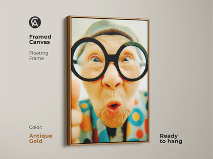 Framed canvas artwork of an older woman wearing glasses. This artwork has a stylish antique gold floating frame. Enhance your home decor with this eye-catching art piece that is ready to hang.