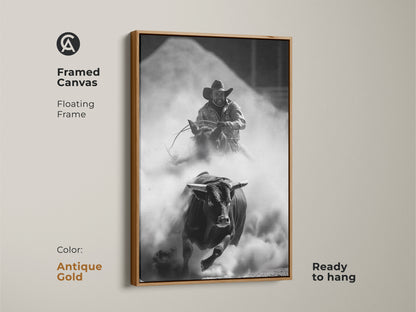 Framed Canvas of a Monochrome Rodeo scene in an antique gold floating frame. This Western wall art features a bull rider and charging bull. The rustic cowboy decor is ready to hang. Perfect for a man cave or office. This adrenaline art print captures the spirit of the rodeo.