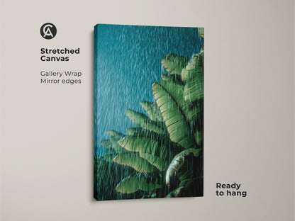 Stretched canvas showcasing tropical banana leaf art in a rain shower. The green botanical wall art is ready to hang. Gallery-wrapped with mirrored edges. Perfect boho plant lover gift for housewarming tropical decor. Nature inspired wall art brings tranquil vibes to any living space or office plant wall.