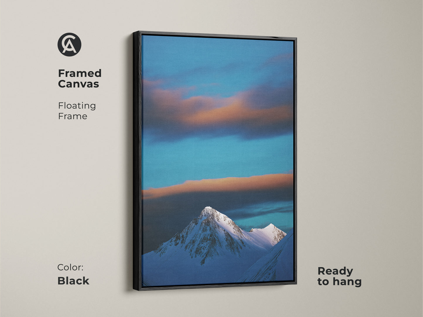 Framed in black this canvas art shows a snowy mountain under a blue sky. The floating frame enhances this contemporary nature wall art. Ready to hang this winter landscape print adds alpine scenery to your modern home decor.