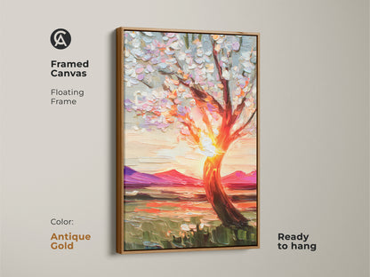 This framed canvas art showcases a blooming tree artwork against a sunset with an antique gold floating frame. The textured print brings vibrant nature decor to any space. Ready to hang this orange yellow and pink landscape is a thoughtful housewarming gift for nature lovers.