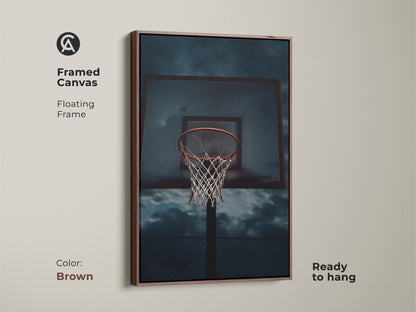 Framed canvas with a floating frame featuring basketball art. Great sports fan wall decor or birthday gift for a basketball player. The basketball hoop artwork is ready to hang. The artwork has a brown frame.