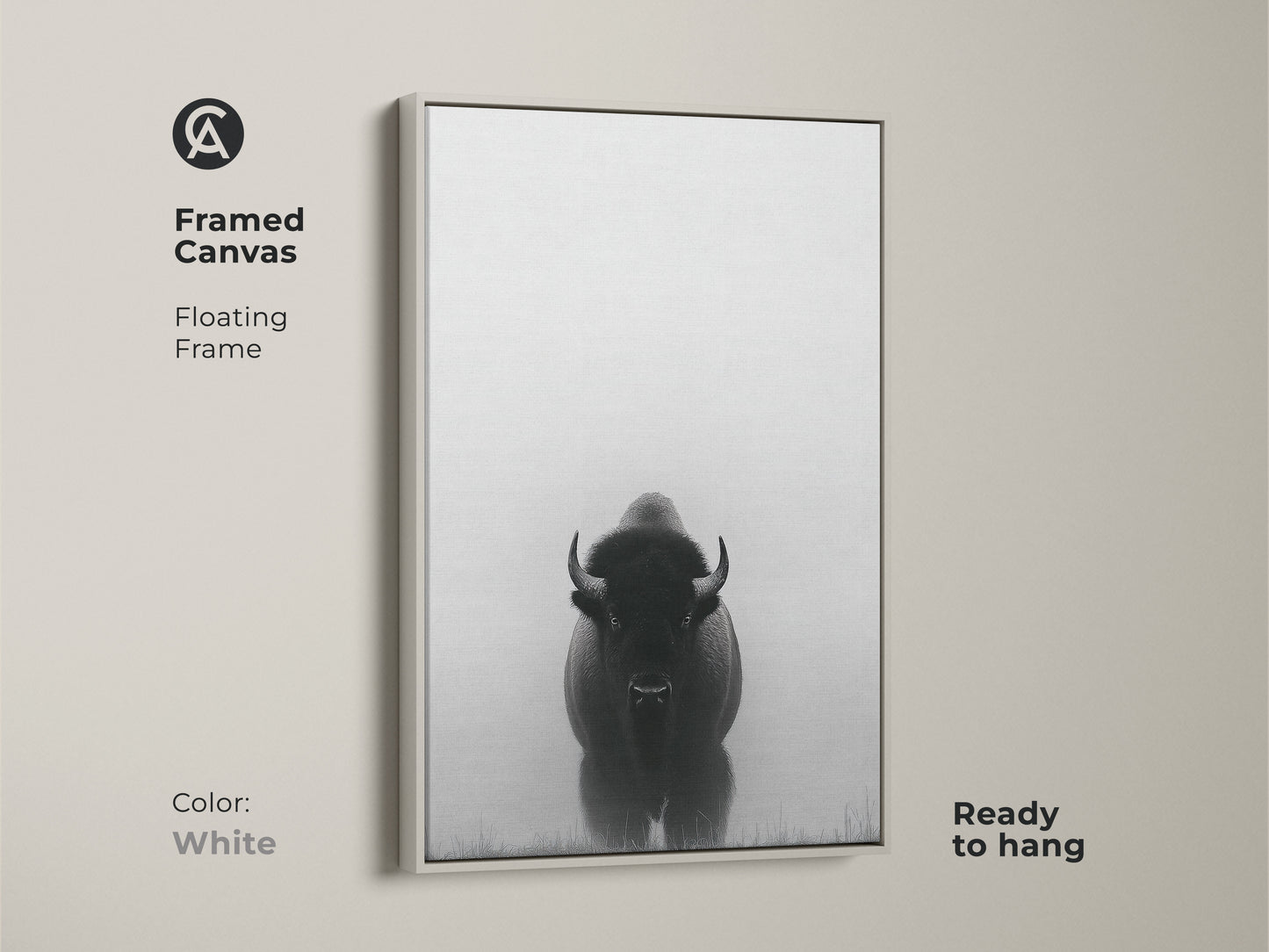 A white frame surrounds a canvas with minimalist bison art. This black and white prairie canvas is ready to hang. The wildlife animal landscape print makes for a rustic farmhouse touch.