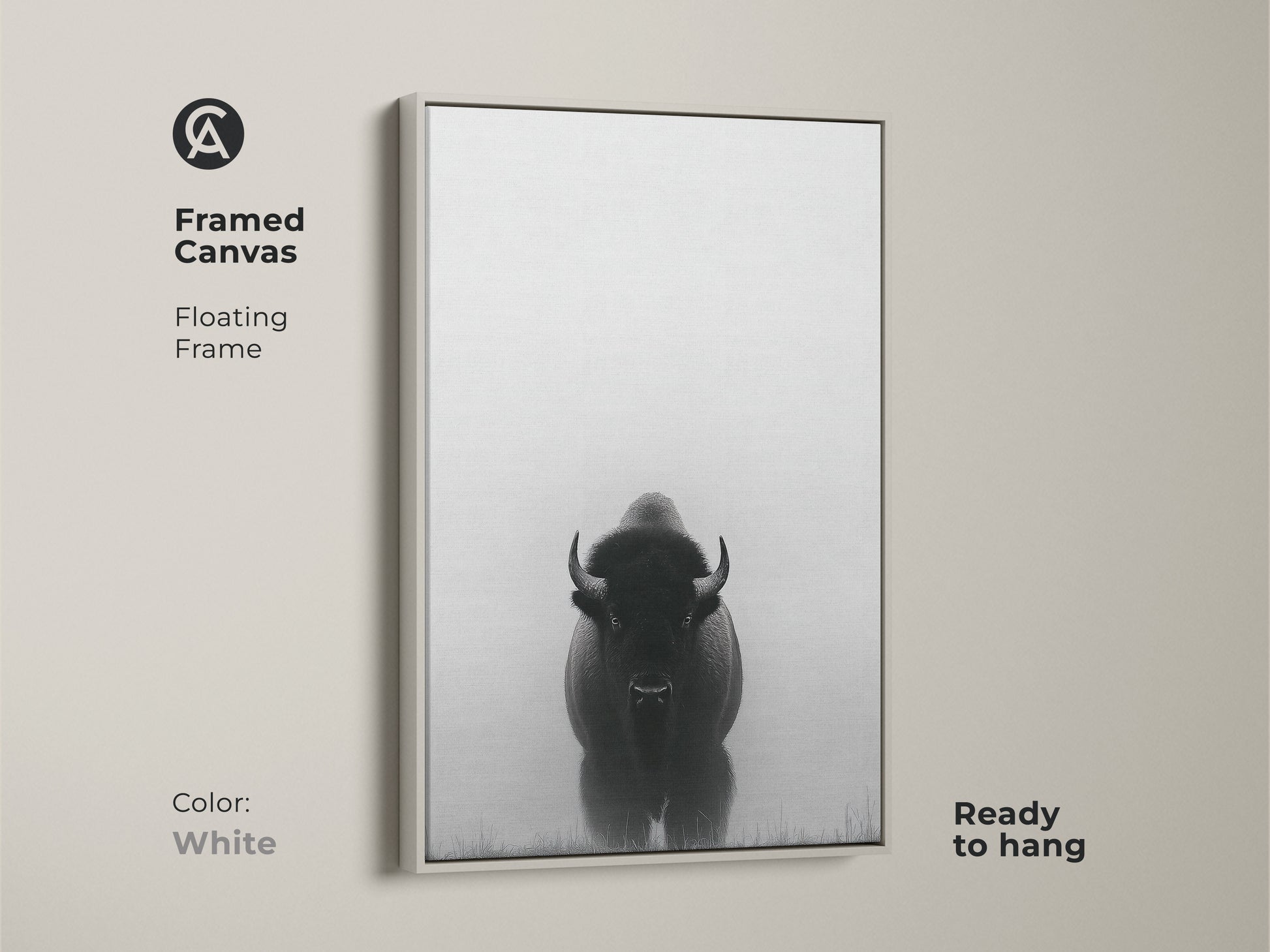 A white frame surrounds a canvas with minimalist bison art. This black and white prairie canvas is ready to hang. The wildlife animal landscape print makes for a rustic farmhouse touch.