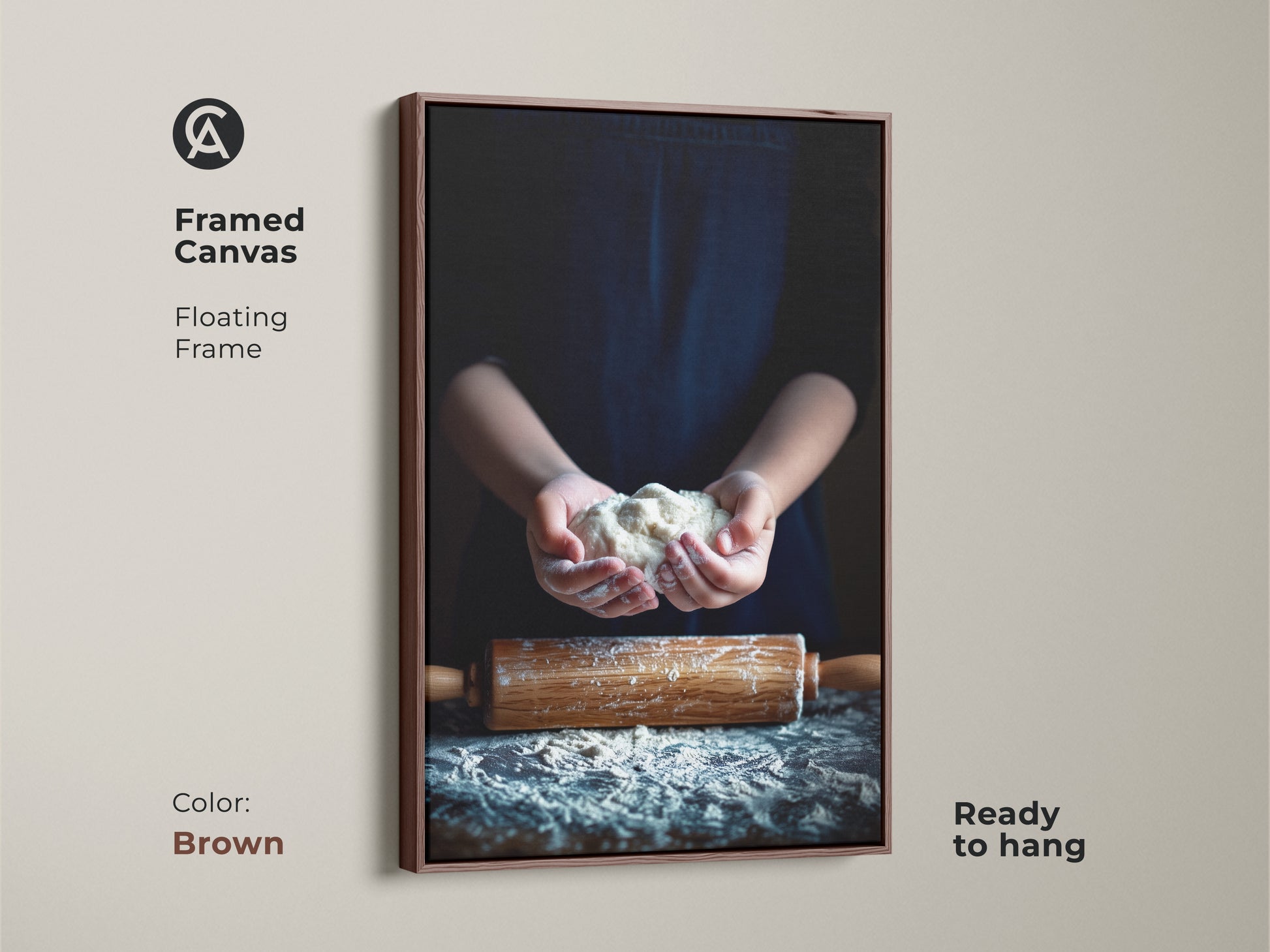 Framed canvas artwork features hands holding dough. The floating frame is brown. Rolling pin art kitchen decor is ready to hang. The modern farmhouse canvas adds charm.