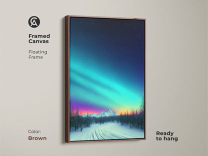 Brown framed canvas of a teal blue and purple aurora borealis over snowy mountain. Floating frame is ready to hang. Dreamy nature landscape art adds beauty to any room. Contemporary landscape art for residential wall decor.