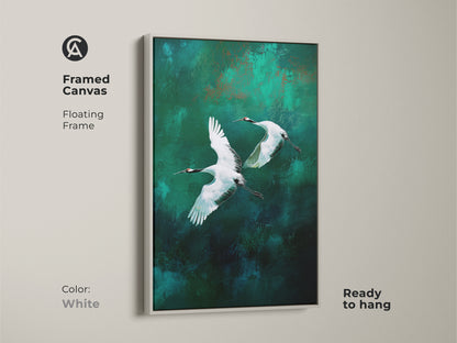 Framed canvas with a white floating frame featuring flying cranes. The emerald and teal create a serene abstract nature scene. This modern artwork will refresh your home and is ready to hang.