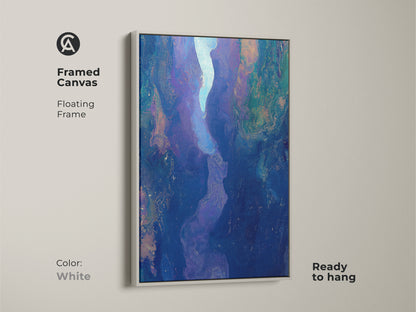 Framed canvas featuring abstract fluid art with a white floating frame. The deep blue purple art print offers contemporary river canyon artwork. Ready to hang this piece will elevate your bedroom or living room decor.
