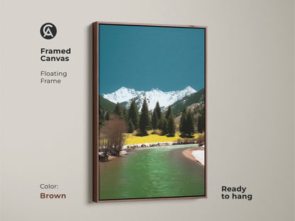 Framed canvas with a floating frame featuring a mountain river artwork. The brown frame complements the pine trees snowy peaks and teal-green water. Ready to hang this artwork brings nature into your home. Ideal for a cozy living space.