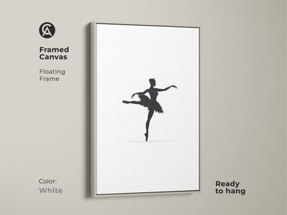 Minimalist black ballerina silhouette art is framed in white. This framed canvas with a floating frame is ready to hang. It is a chic addition to any room. The black and white art print brings a touch of contemporary elegance to a bedroom or studio.