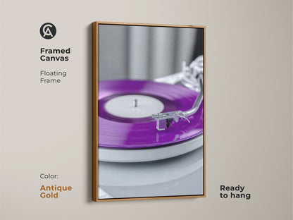 Framed canvas with an antique gold floating frame. The artwork features a purple vinyl record. This turntable canvas print is ready to hang. Perfect for a music studio. It embodies nostalgic music decor.