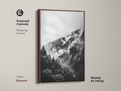 Brown framed canvas displaying a foggy forest art piece. This black and white landscape adds a touch of nature to any room. It's a ready to hang mountain forest art.