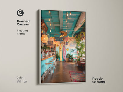 Brighten your decor with this white framed canvas art of a surf shack. The clean white frame complements the vibrant beach bar scene. This ready to hang artwork adds a fresh coastal vibe. The tropical plants and surfboards create a relaxing atmosphere. Perfect for any room.