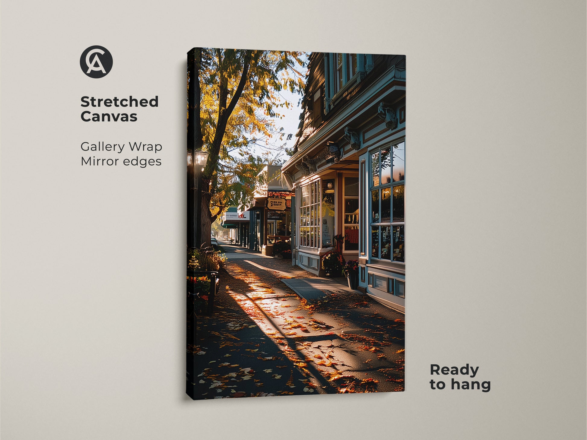 Stretched canvas print of an autumn street scene. Golden hour light enhances the traditional storefront artwork. Gallery wrapped with mirrored edges adds a modern touch. Ready to hang for instant fall decor. A perfect seasonal update for your living space.
