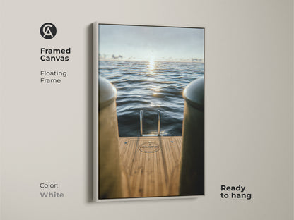 Create a serene ambiance with this framed canvas artwork. The white floating frame highlights the minimalist ocean art. It features a yacht ladder and a calming ocean view. Ideal for modern residential nautical decor.
