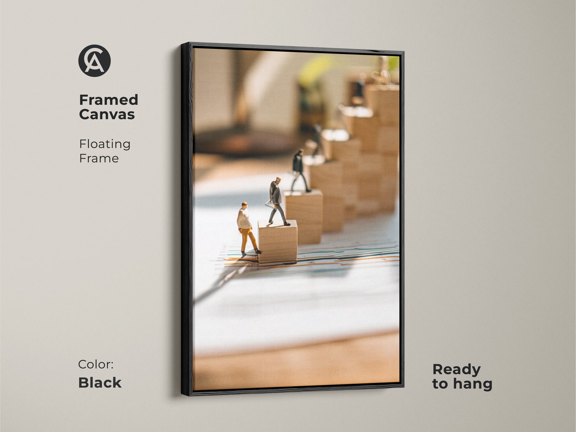 Framed canvas art shows miniature figures climbing wooden blocks. It features a floating frame in black. This office wall art is ready to hang. It adds a modern touch to any workspace. This is conceptual business print and motivational decor.