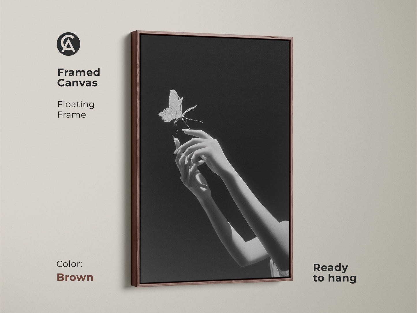 Framed canvas displaying monochrome butterfly art. This surreal hands print is ready to hang. Its floating frame enhances this piece of minimalist art. Ideal as bedroom art the brown frame is the perfect gift for dreamers. This piece is a fusion of contemporary elegance and symbolic nature art.