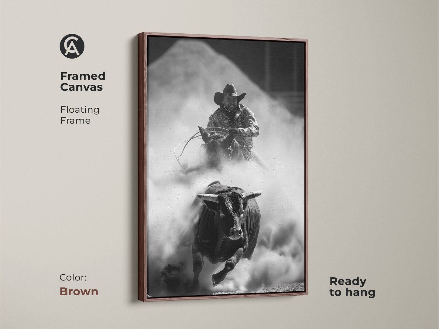 Framed Canvas of a Monochrome Rodeo scene in a brown floating frame. This Western wall art features a bull rider and charging bull. The rustic cowboy decor is ready to hang. Perfect for a man cave or office. This adrenaline art print captures the spirit of the rodeo.