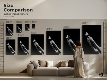 Size comparison of monochrome butterfly art prints. Surreal hands canvas prints are displayed in various sizes. They range from small to extra-large above a sofa. This minimalist black and white art enhances any space. Perfect for bedroom art it’s a unique wall decor gift.