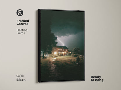 Framed in black this canvas print captures a dramatic lightning strike over a house. This atmospheric nature artwork is ready to hang. A captivating blend of dark blue and yellow hues perfect for modern entryway decor. This is great as a first home gift art.