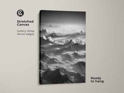 Stretched canvas of a monochrome mountain print. This aerial landscape artwork has minimalist clouds. The black and white mountain art is ready to hang. It is a great hiker gift idea.
