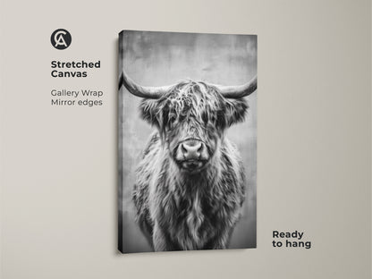 Stretched canvas features a monochrome Highland Cow animal wall art. The black and white cow artwork brings a rustic farmhouse feel to any bedroom. It arrives ready to hang. The gallery wrap adds a modern touch.