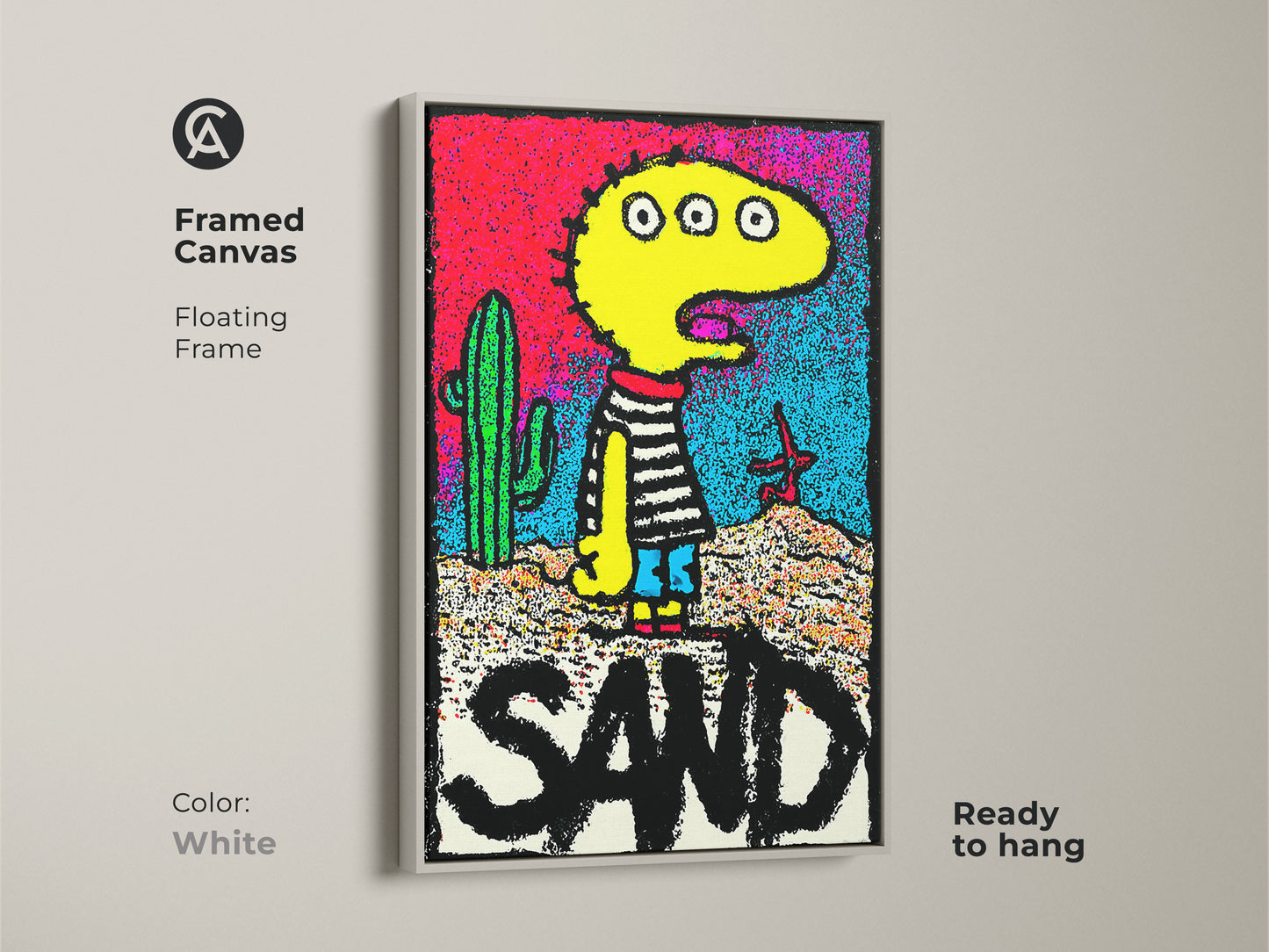 Framed canvas artwork with a floating frame displaying a playful three-eyed character near a cactus. The art includes the word SAND and comes ready to hang. The white frame offers a clean look. Find unique canvas artwork online.