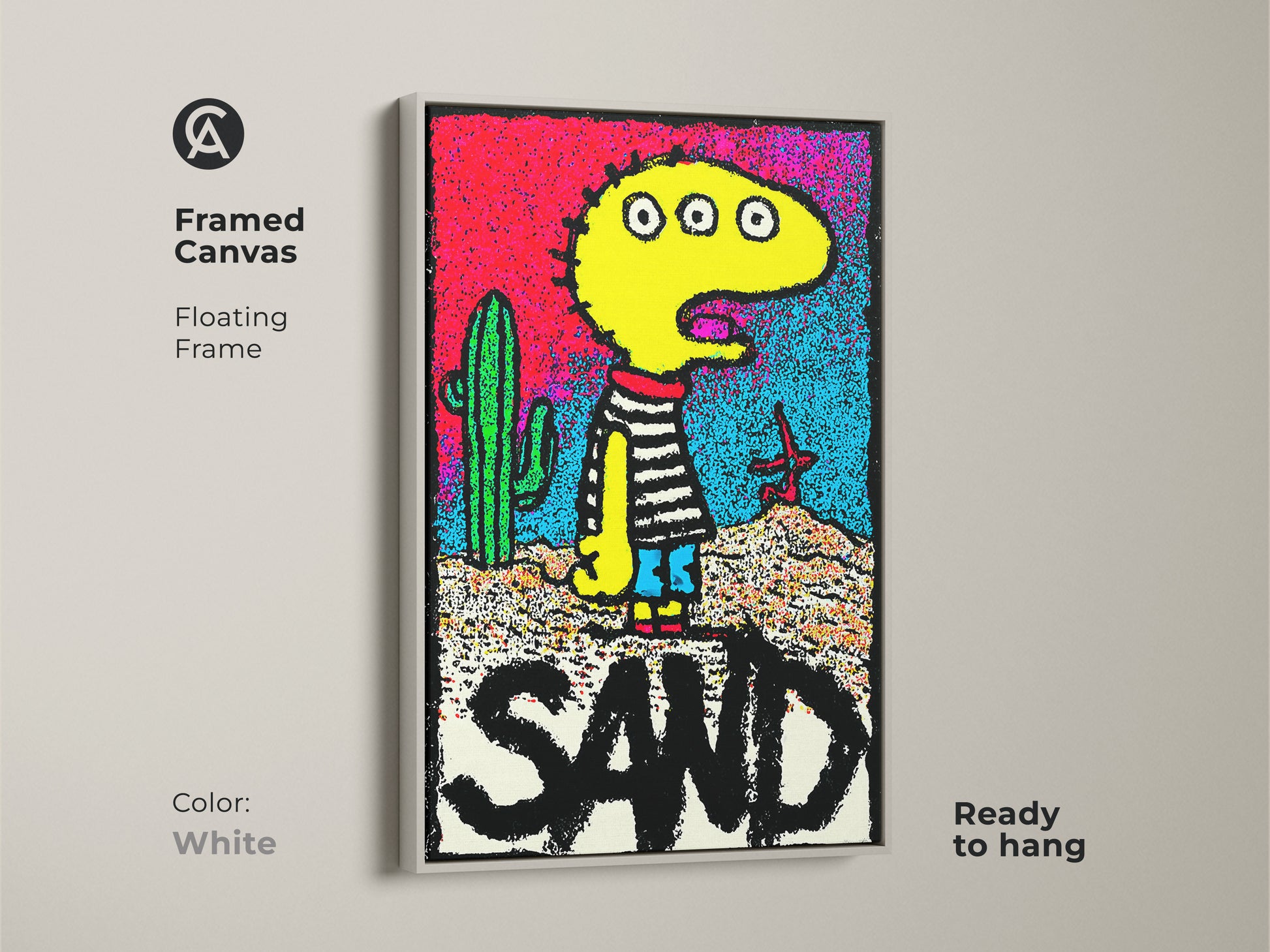 Framed canvas artwork with a floating frame displaying a playful three-eyed character near a cactus. The art includes the word SAND and comes ready to hang. The white frame offers a clean look. Find unique canvas artwork online.