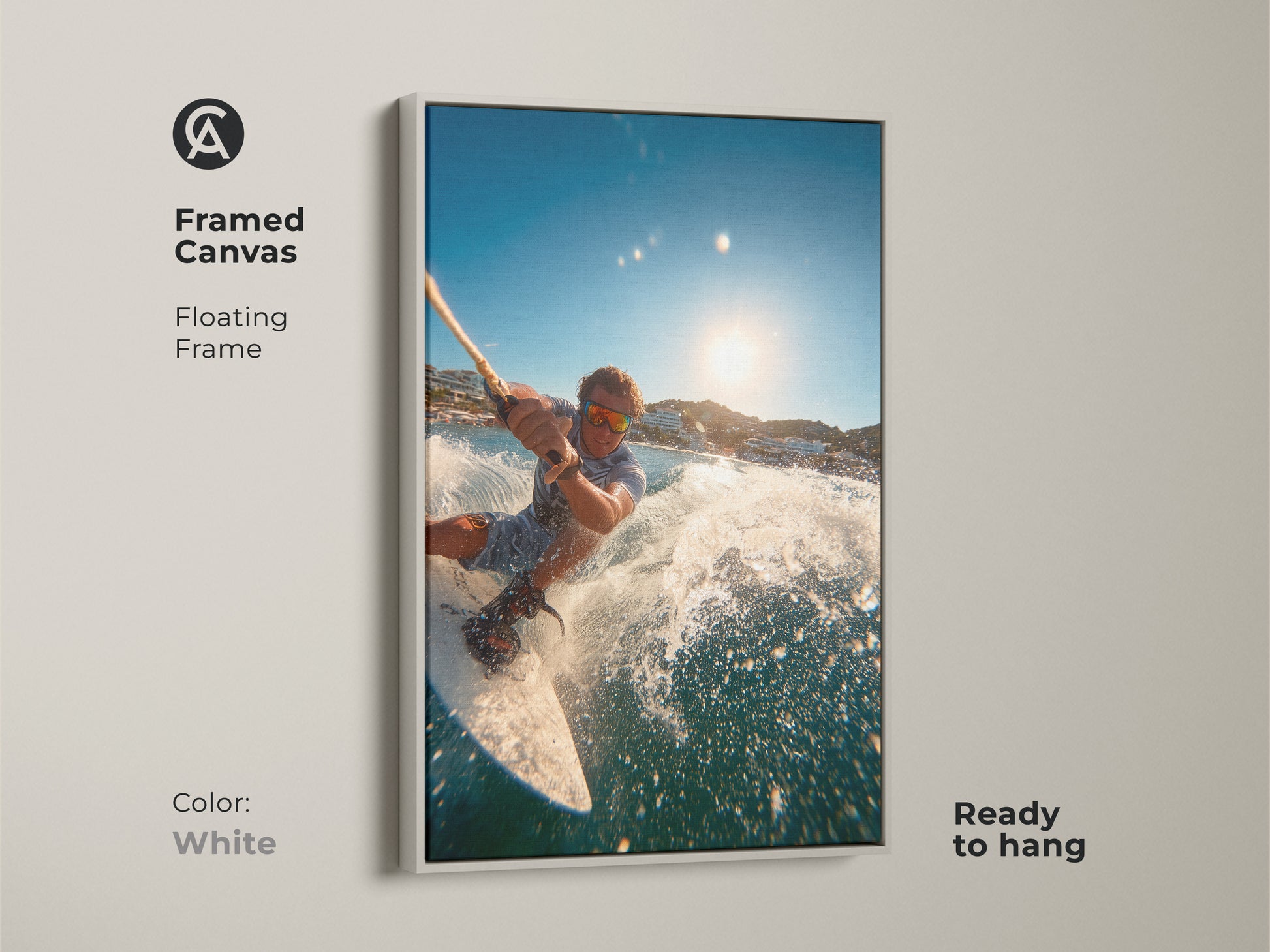 A framed canvas presents a man wakeboarding. It includes a floating frame in white. This artwork is ready to hang. The clean frame highlights the vibrant water scene. It adds a fresh modern touch to any room.
