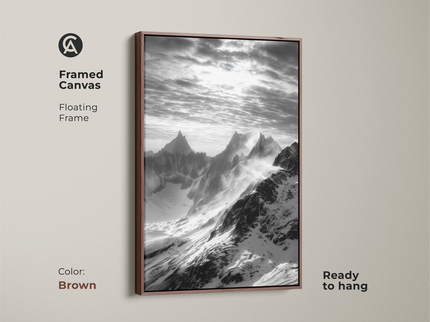 Framed canvas displaying monochrome mountain art. The snowy peaks canvas print is set in a floating brown frame. This black and white landscape enhances any room. Nature wall decor complements modern interiors.