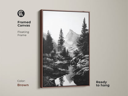 Black and white mountain river art in a floating brown frame. This framed canvas enhances any room. A perfect rustic pine tree landscape that brings nature indoors. An excellent gift for hikers. It features a monochrome outdoor scenery.