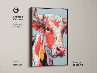 Framed canvas print featuring a colorful cow artwork with a brown floating frame. This ready-to-hang art piece adds warmth. The framed art enhances the vibrant colors. Great for any room.
