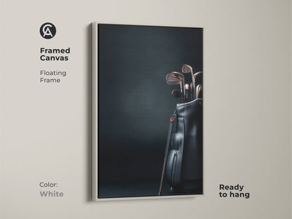 Framed canvas art print featuring golf clubs in a black bag. The floating frame is white. The artwork is ready to hang. This stylish sports themed piece adds sophistication to any room. Purchase this framed art today.