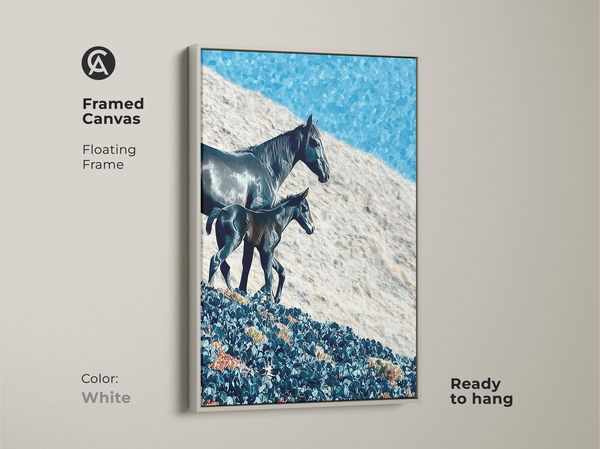 Framed canvas art shows a horse and foal in a floating frame. The rustic landscape canvas features a deep blue sky. This nature themed artwork is ready to hang in a white frame. The frame color is white.