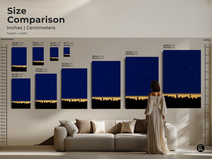 Size comparison of minimalist cityscape art prints on a wall above a sofa. See how 12x18 to 45x67 inch canvas sizes transform your living room. Modern skyline art enhances any home decor. Find your perfect fit today.