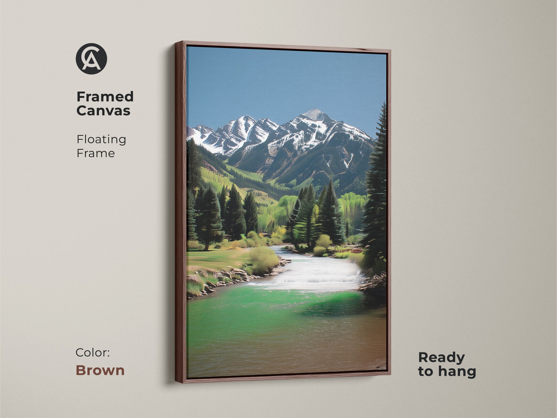 A framed canvas art piece. The scenic mountain river landscape features snow-capped peaks and pine trees. The rustic artwork has a floating brown frame. This piece is ready to hang. Perfect for cabin decor.