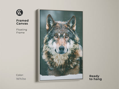 Photorealistic wolf canvas in a white floating frame. This wildlife animal art is ready to hang. Its clean aesthetic complements any room. Perfect for adding winter nature decor. A great gift for wolf lovers. The snowy forest wolf print is captivating.