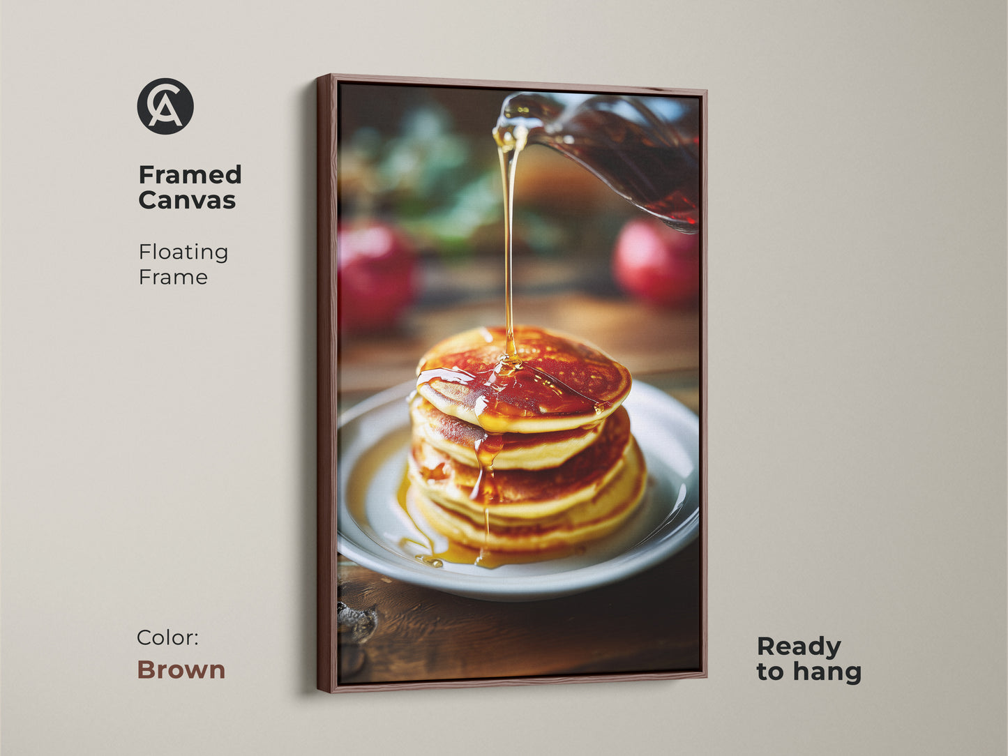 Framed canvas art of pancakes with golden syrup. The floating frame in brown complements the food photography. It's ready to hang and perfect for kitchen decor. This amber and golden yellow art adds warmth to your home. Great for modern farmhouse.