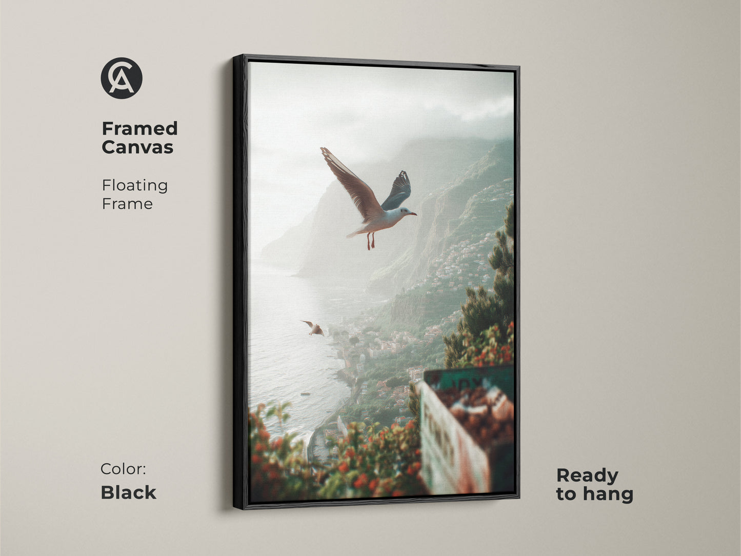 Framed in black canvas of teal green grey coastal artwork. Seagulls soar over a seaside town in this beach landscape art print. This ready-to-hang piece brings a tranquil ocean view and coastal vibe to any living space. The floating frame accentuates the seaside nature art.
