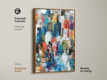 Framed canvas art featuring a colorful abstract cityscape with an antique gold floating frame. The artwork is ready to hang. It brings warmth and sophistication to any interior. This piece provides a stylish decor.
