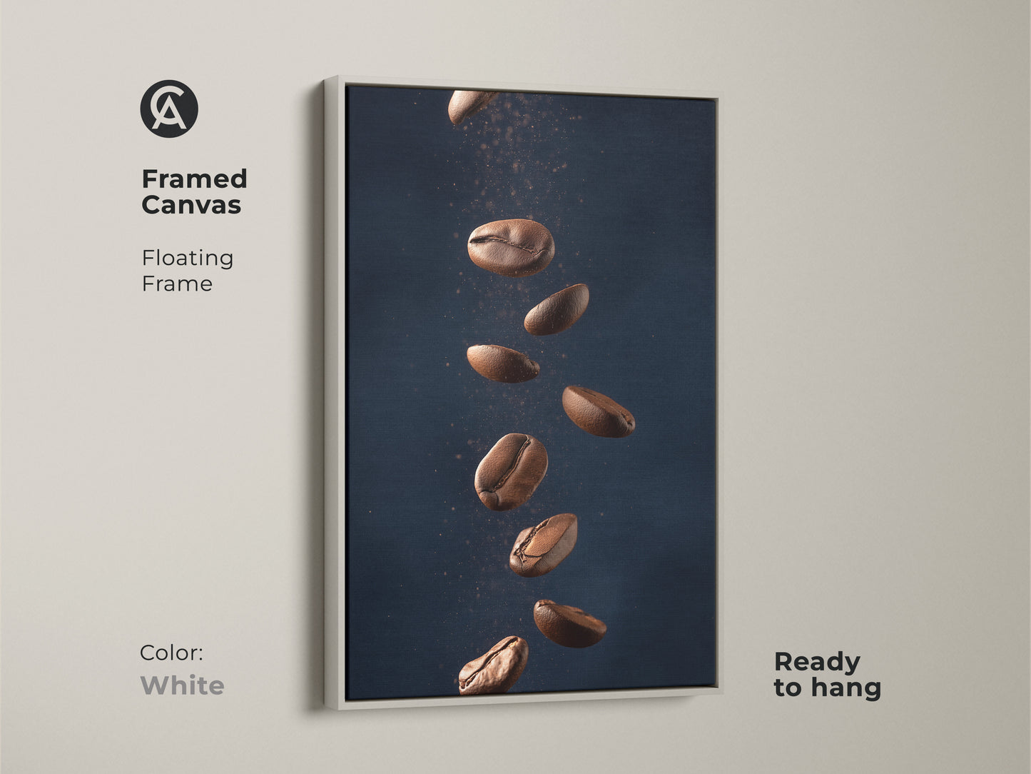 Framed canvas with floating frame featuring abstract coffee art. This minimalist kitchen wall art showcases falling coffee beans. It's a modern Tan and Dark Blue art print. The contemporary coffee decor is ready to hang adding style to any room. The frame is white.