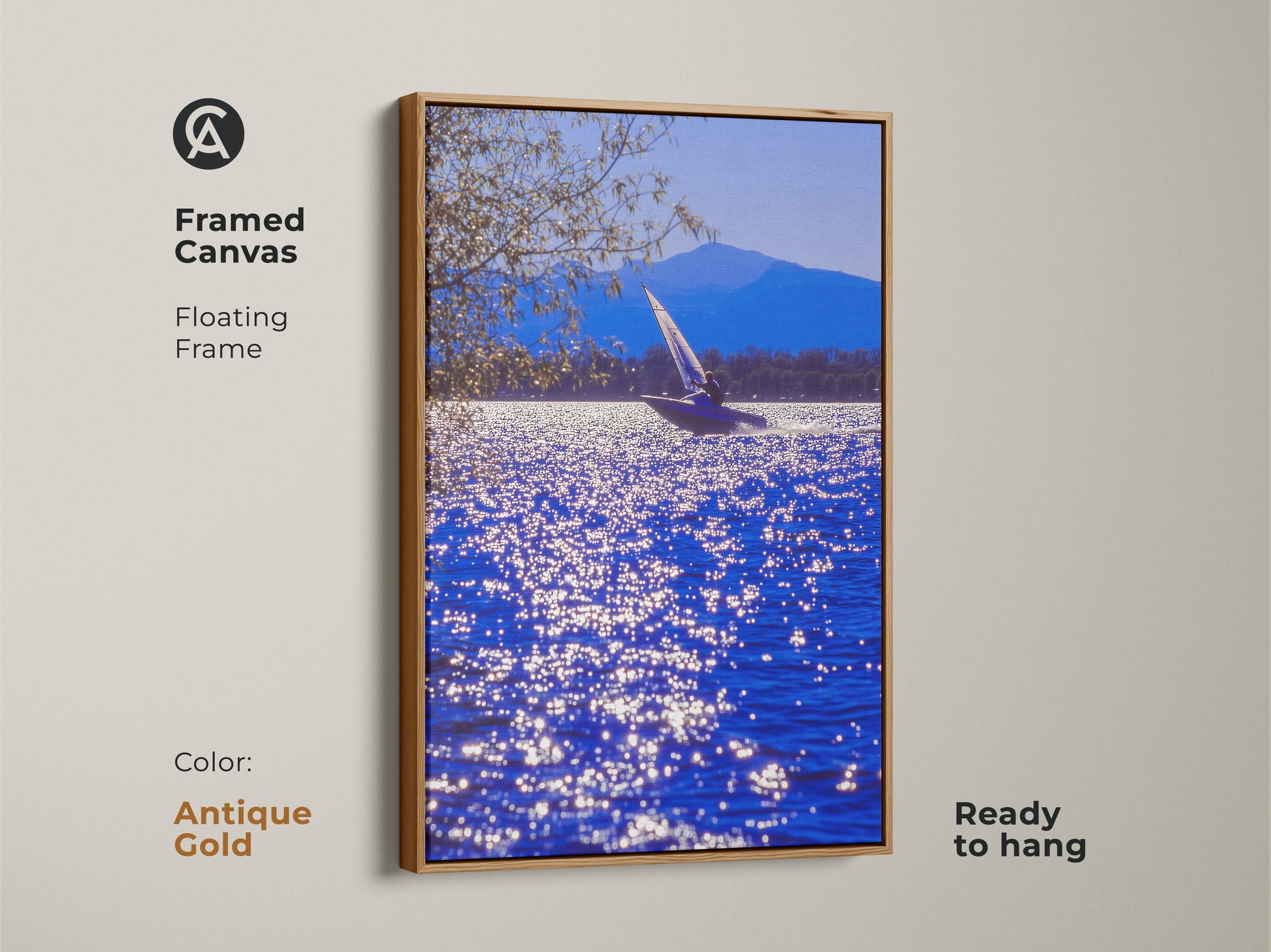 A framed canvas shows a sailboat art print on deep blue water. The antique gold floating frame adds elegance to this nautical artwork. This ready-to-hang coastal scene is perfect as bedroom wall art. It's a unique gift for sailors.