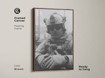 Framed canvas artwork of a soldier in a floating frame with a brown finish. This ready-to-hang print brings a touch of military valor to your home or office decor with this artwork.