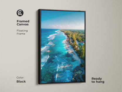 Framed canvas art with a floating frame in black featuring a beautiful beach scene. The aerial beach artwork is ready to hang. This piece adds a touch of elegance to any wall. The floating frame enhances the art's visual appeal.