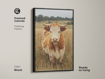This framed canvas presents a cow portrait with a floating frame in black. The cow stands in a field of dry grass. Ready to hang the canvas offers a modern touch to animal art. The contrast enhances the artwork.