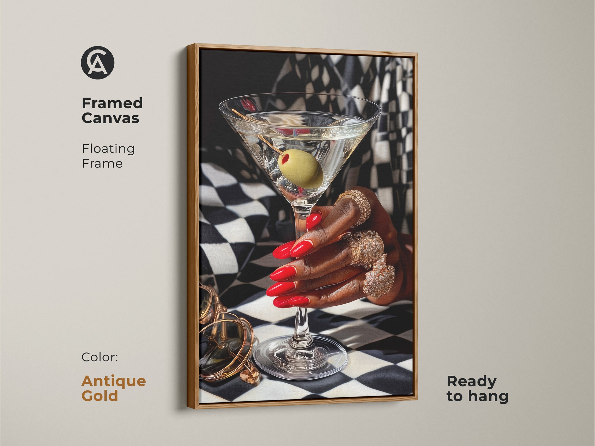 Framed canvas of martini art print with gold jewelry. Art deco artwork featuring red nails and gold rings against a black and white checkered background. Antique gold floating frame adds contemporary style. Glamorous bar decor for a luxury home bar. Perfect gift for cocktail lovers ready to hang.