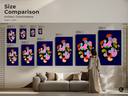 Size comparison of modern abstract art prints in inches and centimeters. The artwork is displayed above a sofa showcasing various sizes. Geometric shapes in indigo pink and green tones are ideal for bedroom office or living room wall artwork.