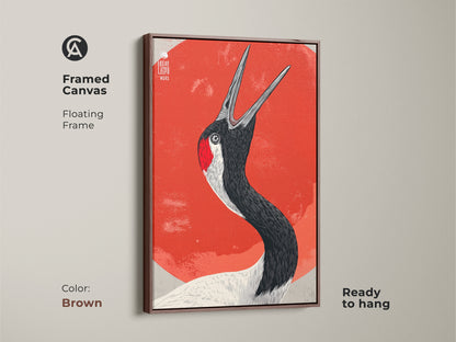 Framed Canvas featuring Japanese Crane wall art displayed in a brown floating frame. This bird artwork red orange brings nature and wildlife to any room. Perfect as a housewarming gift canvas. Add folk art to your decor.