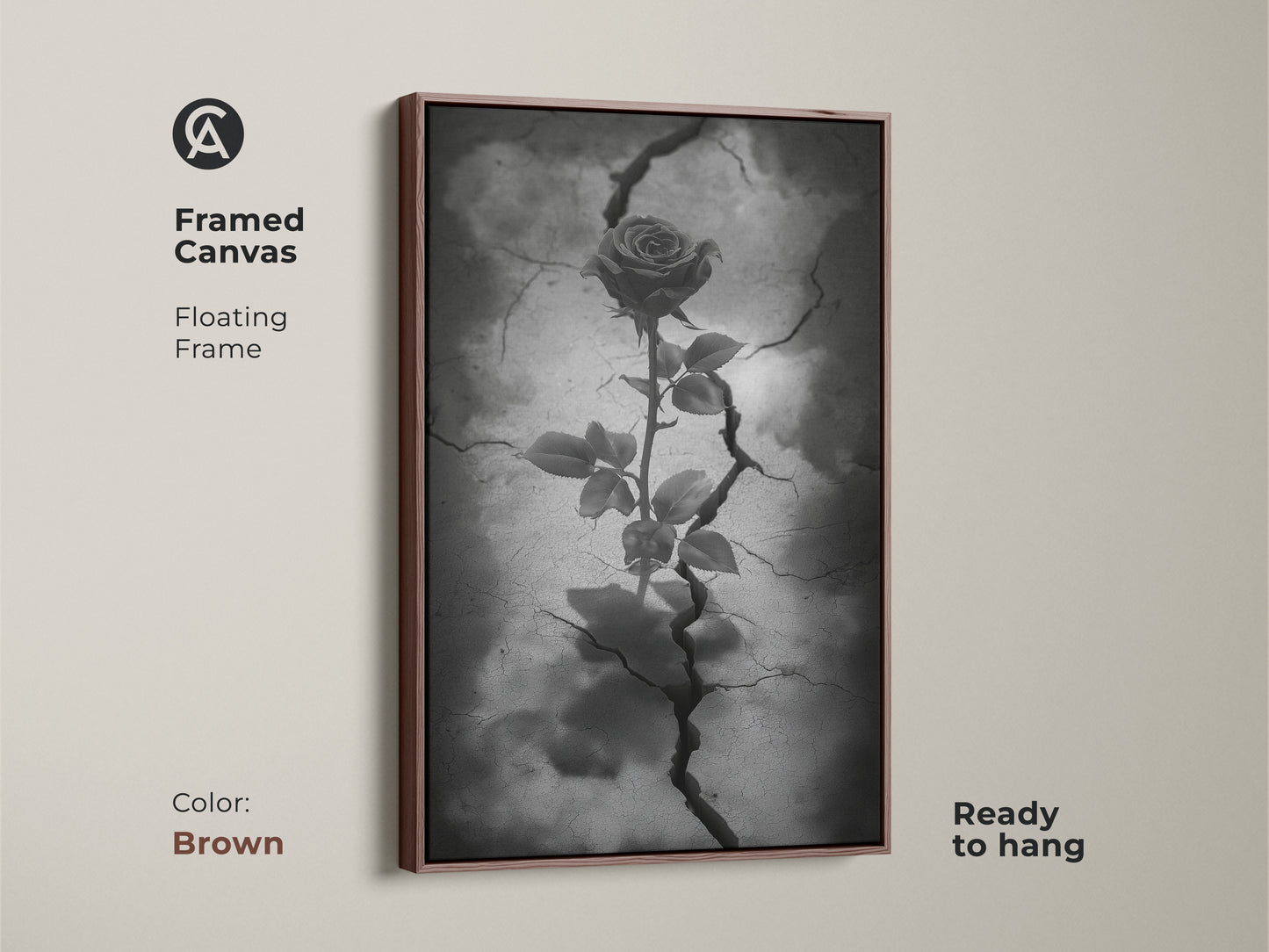 Brown framed canvas showing gothic rose artwork. The floating frame highlights dark floral artwork with a rose from cracked earth. This surreal botanical art is in black white and gray tones. Ready to hang this piece enhances gothic decor. This is symbolic rose art for eclectic home decor.